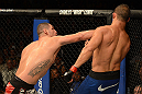LAS VEGAS, NV - DECEMBER 29:  (L-R) Cain Velasquez punches Junior dos Santos during their heavyweight championship fight at UFC 155 on December 29, 2012 at MGM Grand Garden Arena in Las Vegas, Nevada. (Photo by Donald Miralle/Zuffa LLC/Zuffa LLC via Getty Images) *** Local Caption *** Junior dos Santos; Cain Velasquez