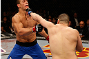 LAS VEGAS, NV - DECEMBER 29:  (R-L) Cain Velasquez punches Junior dos Santos during their heavyweight championship fight at UFC 155 on December 29, 2012 at MGM Grand Garden Arena in Las Vegas, Nevada. (Photo by Josh Hedges/Zuffa LLC/Zuffa LLC via Getty Images) *** Local Caption *** Junior dos Santos; Cain Velasquez