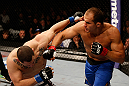 LAS VEGAS, NV - DECEMBER 29:  (R-L) Junior dos Santos punches Cain Velasquez during their heavyweight championship fight at UFC 155 on December 29, 2012 at MGM Grand Garden Arena in Las Vegas, Nevada. (Photo by Josh Hedges/Zuffa LLC/Zuffa LLC via Getty Images) *** Local Caption *** Junior dos Santos; Cain Velasquez