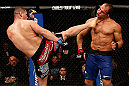 LAS VEGAS, NV - DECEMBER 29:  (L-R) Cain Velasquez kicks Junior dos Santos during their heavyweight championship fight at UFC 155 on December 29, 2012 at MGM Grand Garden Arena in Las Vegas, Nevada. (Photo by Josh Hedges/Zuffa LLC/Zuffa LLC via Getty Images) *** Local Caption *** Junior dos Santos; Cain Velasquez