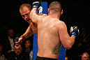 LAS VEGAS, NV - DECEMBER 29:  (R-L) Cain Velasquez punches Junior dos Santos during their heavyweight championship fight at UFC 155 on December 29, 2012 at MGM Grand Garden Arena in Las Vegas, Nevada. (Photo by Josh Hedges/Zuffa LLC/Zuffa LLC via Getty Images) *** Local Caption *** Junior dos Santos; Cain Velasquez