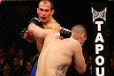 LAS VEGAS, NV - DECEMBER 29:  (R-L) Cain Velasquez punches Junior dos Santos during their heavyweight championship fight at UFC 155 on December 29, 2012 at MGM Grand Garden Arena in Las Vegas, Nevada. (Photo by Josh Hedges/Zuffa LLC/Zuffa LLC via Getty Images) *** Local Caption *** Junior dos Santos; Cain Velasquez