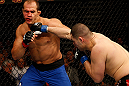 LAS VEGAS, NV - DECEMBER 29:  (R-L) Cain Velasquez punches Junior dos Santos during their heavyweight championship fight at UFC 155 on December 29, 2012 at MGM Grand Garden Arena in Las Vegas, Nevada. (Photo by Josh Hedges/Zuffa LLC/Zuffa LLC via Getty Images) *** Local Caption *** Junior dos Santos; Cain Velasquez