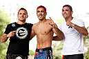 SAO PAULO, BRAZIL - JANUARY 16:  Godofredo "Pepey" Castro (center) poses for photos with his team after an open workout session for media and fans on January 16, 2013 at Parque Anhangabau in Sao Paulo, Brazil. (Photo by Josh Hedges/Zuffa LLC/Zuffa LLC via Getty Images)