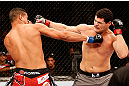 SAO PAULO, BRAZIL - JANUARY 19:  (L-R) Ildemar Alcantara and Wagner Prado trade punches in their light heavyweight fight at the UFC on FX event on January 19, 2013 at Ibirapuera Gymnasium in Sao Paulo, Brazil. (Photo by Josh Hedges/Zuffa LLC/Zuffa LLC via Getty Images)