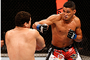 SAO PAULO, BRAZIL - JANUARY 19:  (R-L) Ildemar Alcantara punches Wagner Prado in their light heavyweight fight at the UFC on FX event on January 19, 2013 at Ibirapuera Gymnasium in Sao Paulo, Brazil. (Photo by Josh Hedges/Zuffa LLC/Zuffa LLC via Getty Images)