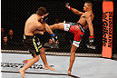SAO PAULO, BRAZIL - JANUARY 19:  (R-L) Yuri Alcantara kicks Pedro Nobre in their bantamweight fight at the UFC on FX event on January 19, 2013 at Ibirapuera Gymnasium in Sao Paulo, Brazil. (Photo by Josh Hedges/Zuffa LLC/Zuffa LLC via Getty Images)