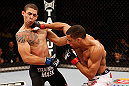 SAO PAULO, BRAZIL - JANUARY 19:  (R-L) Edson Barboza punches Lucas Martins in their lightweight fight at the UFC on FX event on January 19, 2013 at Ibirapuera Gymnasium in Sao Paulo, Brazil. (Photo by Josh Hedges/Zuffa LLC/Zuffa LLC via Getty Images)