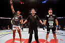 SAO PAULO, BRAZIL - JANUARY 19:  Edson Barboza (L) reacts after knocking out Lucas Martins in their lightweight fight at the UFC on FX event on January 19, 2013 at Ibirapuera Gymnasium in Sao Paulo, Brazil. (Photo by Josh Hedges/Zuffa LLC/Zuffa LLC via Getty Images)