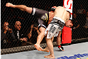 SAO PAULO, BRAZIL - JANUARY 19:  Nik Lentz (white shorts) takes down Diego Nunes in their featherweight fight at the UFC on FX event on January 19, 2013 at Ibirapuera Gymnasium in Sao Paulo, Brazil. (Photo by Josh Hedges/Zuffa LLC/Zuffa LLC via Getty Images)
