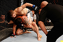 SAO PAULO, BRAZIL - JANUARY 19:  Nik Lentz (white shorts) punches Diego Nunes in their featherweight fight at the UFC on FX event on January 19, 2013 at Ibirapuera Gymnasium in Sao Paulo, Brazil. (Photo by Josh Hedges/Zuffa LLC/Zuffa LLC via Getty Images)