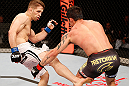 SAO PAULO, BRAZIL - JANUARY 19:  (L-R) Nik Lentz kicks Diego Nunes in their featherweight fight at the UFC on FX event on January 19, 2013 at Ibirapuera Gymnasium in Sao Paulo, Brazil. (Photo by Josh Hedges/Zuffa LLC/Zuffa LLC via Getty Images)