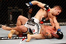 SAO PAULO, BRAZIL - JANUARY 19:  Nik Lentz (white shorts) punches Diego Nunes in their featherweight fight at the UFC on FX event on January 19, 2013 at Ibirapuera Gymnasium in Sao Paulo, Brazil. (Photo by Josh Hedges/Zuffa LLC/Zuffa LLC via Getty Images)