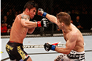 SAO PAULO, BRAZIL - JANUARY 19:  (R-L) Nik Lentz and Diego Nunes trade punches in their featherweight fight at the UFC on FX event on January 19, 2013 at Ibirapuera Gymnasium in Sao Paulo, Brazil. (Photo by Josh Hedges/Zuffa LLC/Zuffa LLC via Getty Images)