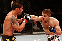 SAO PAULO, BRAZIL - JANUARY 19:  Nik Lentz (white shorts) punches Diego Nunes in their featherweight fight at the UFC on FX event on January 19, 2013 at Ibirapuera Gymnasium in Sao Paulo, Brazil. (Photo by Josh Hedges/Zuffa LLC/Zuffa LLC via Getty Images)