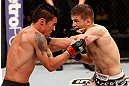 SAO PAULO, BRAZIL - JANUARY 19:  Nik Lentz (white shorts) punches Diego Nunes in their featherweight fight at the UFC on FX event on January 19, 2013 at Ibirapuera Gymnasium in Sao Paulo, Brazil. (Photo by Josh Hedges/Zuffa LLC/Zuffa LLC via Getty Images)