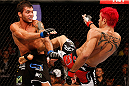 SAO PAULO, BRAZIL - JANUARY 19:  (R-L) Godofredo "Pepey" Castro kicks Milton Vieira in their featherweight fight at the UFC on FX event on January 19, 2013 at Ibirapuera Gymnasium in Sao Paulo, Brazil. (Photo by Josh Hedges/Zuffa LLC/Zuffa LLC via Getty Images)