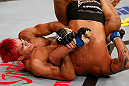 SAO PAULO, BRAZIL - JANUARY 19:  (L-R) Godofredo "Pepey" Castro attempts a shoulder lock submission against Milton Vieira in their featherweight fight at the UFC on FX event on January 19, 2013 at Ibirapuera Gymnasium in Sao Paulo, Brazil. (Photo by Josh Hedges/Zuffa LLC/Zuffa LLC via Getty Images)