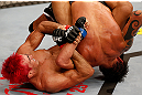 SAO PAULO, BRAZIL - JANUARY 19:  (L-R) Godofredo "Pepey" Castro attempts a shoulder lock submission against Milton Vieira in their featherweight fight at the UFC on FX event on January 19, 2013 at Ibirapuera Gymnasium in Sao Paulo, Brazil. (Photo by Josh Hedges/Zuffa LLC/Zuffa LLC via Getty Images)
