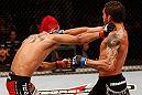 SAO PAULO, BRAZIL - JANUARY 19:  (L-R) Godofredo "Pepey" Castro and Milton Vieira trade punches in their featherweight fight at the UFC on FX event on January 19, 2013 at Ibirapuera Gymnasium in Sao Paulo, Brazil. (Photo by Josh Hedges/Zuffa LLC/Zuffa LLC via Getty Images)