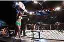SAO PAULO, BRAZIL - JANUARY 19:  UFC Octagon Girl Camila Rodrigues de Oliveira introduces a round during the UFC on FX event on January 19, 2013 at Ibirapuera Gymnasium in Sao Paulo, Brazil. (Photo by Josh Hedges/Zuffa LLC/Zuffa LLC via Getty Images)