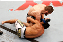 SAO PAULO, BRAZIL - JANUARY 19:  Khabib Nurmagomedov (top) elbows Thiago Tavares in their lightweight fight at the UFC on FX event on January 19, 2013 at Ibirapuera Gymnasium in Sao Paulo, Brazil. (Photo by Josh Hedges/Zuffa LLC/Zuffa LLC via Getty Images)