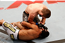 SAO PAULO, BRAZIL - JANUARY 19:  Khabib Nurmagomedov (top) elbows Thiago Tavares in their lightweight fight at the UFC on FX event on January 19, 2013 at Ibirapuera Gymnasium in Sao Paulo, Brazil. (Photo by Josh Hedges/Zuffa LLC/Zuffa LLC via Getty Images)