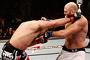 SAO PAULO, BRAZIL - JANUARY 19:  (L-R) Gabriel Gonzaga punches Ben Rothwell  in their heavyweight fight at the UFC on FX event on January 19, 2013 at Ibirapuera Gymnasium in Sao Paulo, Brazil. (Photo by Josh Hedges/Zuffa LLC/Zuffa LLC via Getty Images)
