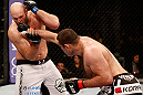 SAO PAULO, BRAZIL - JANUARY 19:  (R-L) Gabriel Gonzaga punches Ben Rothwell  in their heavyweight fight at the UFC on FX event on January 19, 2013 at Ibirapuera Gymnasium in Sao Paulo, Brazil. (Photo by Josh Hedges/Zuffa LLC/Zuffa LLC via Getty Images)