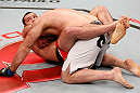 SAO PAULO, BRAZIL - JANUARY 19:  (L-R) Gabriel Gonzaga secures a guillotine choke submission against Ben Rothwell in their heavyweight fight at the UFC on FX event on January 19, 2013 at Ibirapuera Gymnasium in Sao Paulo, Brazil. (Photo by Josh Hedges/Zuffa LLC/Zuffa LLC via Getty Images)
