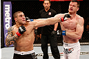 SAO PAULO, BRAZIL - JANUARY 19:  (L-R) Daniel Sarafian and C.B. Dolloway trade punches in their middleweight fight at the UFC on FX event on January 19, 2013 at Ibirapuera Gymnasium in Sao Paulo, Brazil. (Photo by Josh Hedges/Zuffa LLC/Zuffa LLC via Getty Images)
