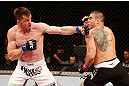 SAO PAULO, BRAZIL - JANUARY 19:  (L-R) C.B. Dolloway punches Daniel Sarafian in their middleweight fight at the UFC on FX event on January 19, 2013 at Ibirapuera Gymnasium in Sao Paulo, Brazil. (Photo by Josh Hedges/Zuffa LLC/Zuffa LLC via Getty Images)