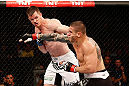 SAO PAULO, BRAZIL - JANUARY 19:  (L-R) C.B. Dolloway punches Daniel Sarafian in their middleweight fight at the UFC on FX event on January 19, 2013 at Ibirapuera Gymnasium in Sao Paulo, Brazil. (Photo by Josh Hedges/Zuffa LLC/Zuffa LLC via Getty Images)