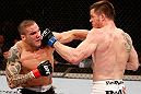 SAO PAULO, BRAZIL - JANUARY 19:  (R-L) C.B. Dolloway and Daniel Sarafian trade punches in their middleweight fight at the UFC on FX event on January 19, 2013 at Ibirapuera Gymnasium in Sao Paulo, Brazil. (Photo by Josh Hedges/Zuffa LLC/Zuffa LLC via Getty Images)