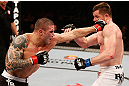 SAO PAULO, BRAZIL - JANUARY 19:  (L-R) Daniel Sarafian punches C.B. Dolloway in their middleweight fight at the UFC on FX event on January 19, 2013 at Ibirapuera Gymnasium in Sao Paulo, Brazil. (Photo by Josh Hedges/Zuffa LLC/Zuffa LLC via Getty Images)