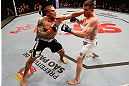 SAO PAULO, BRAZIL - JANUARY 19:  (L-R) Daniel Sarafian punches C.B. Dolloway in their middleweight fight at the UFC on FX event on January 19, 2013 at Ibirapuera Gymnasium in Sao Paulo, Brazil. (Photo by Josh Hedges/Zuffa LLC/Zuffa LLC via Getty Images)