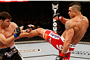 SAO PAULO, BRAZIL - JANUARY 19:  (R-L) Vitor Belfort kicks Michael Bisping in their middleweight fight at the UFC on FX event on January 19, 2013 at Ibirapuera Gymnasium in Sao Paulo, Brazil. (Photo by Josh Hedges/Zuffa LLC/Zuffa LLC via Getty Images)