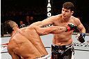 SAO PAULO, BRAZIL - JANUARY 19:  (R-L) Michael Bisping punches Vitor Belfort in their middleweight fight at the UFC on FX event on January 19, 2013 at Ibirapuera Gymnasium in Sao Paulo, Brazil. (Photo by Josh Hedges/Zuffa LLC/Zuffa LLC via Getty Images)