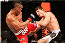 SAO PAULO, BRAZIL - JANUARY 19:  (L-R) Vitor Belfort kicks Michael Bisping in their middleweight fight at the UFC on FX event on January 19, 2013 at Ibirapuera Gymnasium in Sao Paulo, Brazil. (Photo by Josh Hedges/Zuffa LLC/Zuffa LLC via Getty Images)