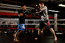 CHICAGO, IL - JANUARY 23:  John Dodson (L) conducts an open workout session for media on January 23, 2013 at UFC Gym in Chicago, Illinois. (Photo by Josh Hedges/Zuffa LLC/Zuffa LLC via Getty Images)
