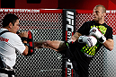 CHICAGO, IL - JANUARY 23:  Donald "Cowboy" Cerrone (R) conducts an open workout session for media on January 23, 2013 at UFC Gym in Chicago, Illinois. (Photo by Josh Hedges/Zuffa LLC/Zuffa LLC via Getty Images)