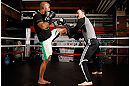 CHICAGO, IL - JANUARY 23:  Demetrious "Mighty Mouse" Johnson (L) conducts an open workout session for media on January 23, 2013 at UFC Gym in Chicago, Illinois. (Photo by Josh Hedges/Zuffa LLC/Zuffa LLC via Getty Images)