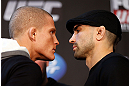 CHICAGO, IL - JANUARY 24:  (L-R) Opponents Erik Koch and Ricardo Lamas face off during the UFC on FOX press conference on January 24, 2013 at the United Center in Chicago, Illinois. (Photo by Josh Hedges/Zuffa LLC/Zuffa LLC via Getty Images)