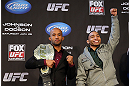 CHICAGO, IL - JANUARY 24:  (L-R) Opponents Demetrious "Mighty Mouse" Johnson and John Dodson pose for photos during the UFC on FOX press conference on January 24, 2013 at the United Center in Chicago, Illinois. (Photo by Josh Hedges/Zuffa LLC/Zuffa LLC via Getty Images)