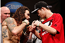 CHICAGO, IL - JANUARY 25:  (L-R) Opponents Clay Guida and Hatsu Hioki face off during the UFC on FOX weigh-in on January 25, 2013 at the Chicago Theatre in Chicago, Illinois. (Photo by Josh Hedges/Zuffa LLC/Zuffa LLC via Getty Images)