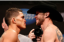 CHICAGO, IL - JANUARY 25:  (L-R) Opponents Anthony Pettis and Donald "Cowboy" Cerrone face off during the UFC on FOX weigh-in on January 25, 2013 at the Chicago Theatre in Chicago, Illinois. (Photo by Josh Hedges/Zuffa LLC/Zuffa LLC via Getty Images)