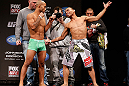 CHICAGO, IL - JANUARY 25:  (L-R) Opponents Demetrious Johnson and John Dodson face off during the UFC on FOX weigh-in on January 25, 2013 at the Chicago Theatre in Chicago, Illinois. (Photo by Josh Hedges/Zuffa LLC/Zuffa LLC via Getty Images)