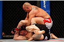 CHICAGO, IL - JANUARY 26:  Shawn Jordan (Top) punches Mike Russow (Bottom) during their Heavyweight Bout part of UFC on FOX at United Center on January 26, 2013 in Chicago, Illinois.  (Photo by Josh Hedges/Zuffa LLC/Zuffa LLC Via Getty Images)