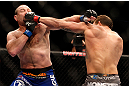 CHICAGO, IL - JANUARY 26:  Vladimir Matyushenko (L) gets punched by Ryan Bader (R) during their Light Heavyweight Bout part of UFC on FOX at United Center on January 26, 2013 in Chicago, Illinois.  (Photo by Josh Hedges/Zuffa LLC/Zuffa LLC Via Getty Images)