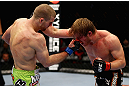 CHICAGO, IL - JANUARY 26:  Pascal Krauss (L) punches Mike Stumpf (R) during their Welterweight Bout part of UFC on FOX at United Center on January 26, 2013 in Chicago, Illinois.  (Photo by Al Bello/Zuffa LLC/Zuffa LLC Via Getty Images)
